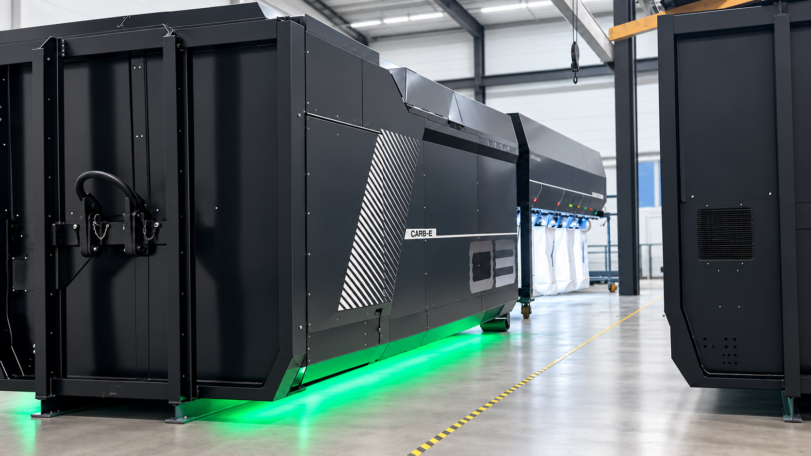 CARB-E and OCTOBUS operating together in a clean industrial hall, with the green processing-status light visible below the machine